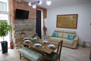 a living room with a table and a couch at Redondilla in Madrid