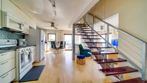 a kitchen with a spiral staircase in a house at Seven Mile View Condo #1 in West Bay