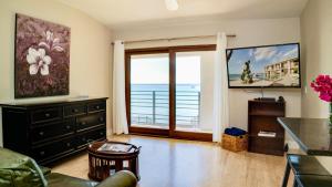 a living room with a view of the ocean at Seven Mile View Condo #3B in West Bay