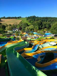 a water park with a bunch of water slides at Spacieuse Maison de ville - Quartier Calme - 10 Personnes in Oloron-Sainte-Marie