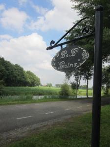 a sign on the side of a road at B&B Beatrix in Beilen