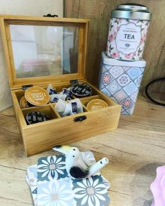 a wooden box with a toy bird sitting in it at Boutique apartment Bansko Bell Tower in Bansko +46 photos