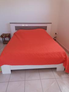 Ένα ή περισσότερα κρεβάτια σε δωμάτιο στο les flamboyants