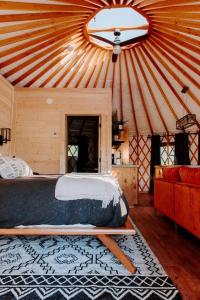 a large room with a bed in a yurt at Santeetlah @ Sky Ridge Yurts in Bryson City