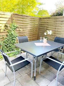 a blue table and chairs on a patio at 3 bedrooms appartement with terrace and wifi at Lorsch in Lorsch