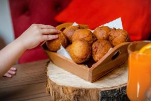 a box of muffins sitting on top of a table at Suite Terrace Rooms & Apartments in Korçë