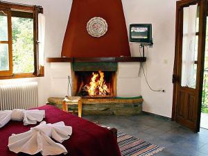 Postel nebo postele na pokoji v ubytování Guesthouse Rousis