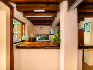 a kitchen with a counter in a house at Posada Real del Valle in Valle de Bravo