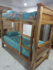 a couple of bunk beds in a room at CABAÑA MANANTIAL DE DIOS in Turbo