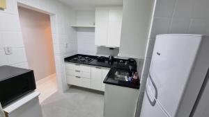 A cozinha ou kitchenette de Copa-Leme Apart 150m da praia