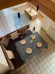 a living room with a table with plates on it at Forest Apartment in St. Blasien