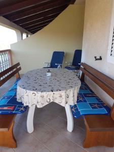 a table and chairs in a room with a table and chairs at Apartment in Lopar with Two-Bedrooms 3 in Lopar