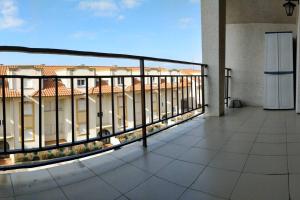 a balcony with a view of a building at IAROS El Coto in Mogro