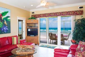 a living room with a view of the ocean at Parrot-ise 4 Bedroom Villa in Brinkleys