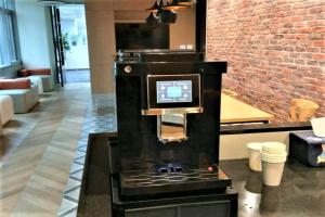 a black stove in a room with a brick wall at OYO Hotel Guymon OK US-54 in Guymon