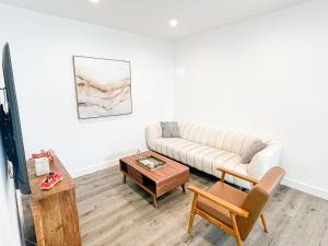 a living room with a couch and a table at Cozy Habitat in Los Angeles