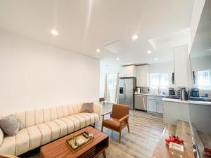 a living room with a couch and a table at Cozy Habitat in Los Angeles