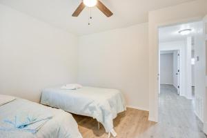 a bedroom with two beds and a ceiling fan at Updated Mangum Home about 14 Mi to Quartz Mountain! in Mangum