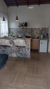 A kitchen or kitchenette at Pousada Casa no Sitio