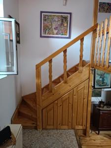a wooden staircase in a room with a stair case at Maravilja 2 in Filmski Grad