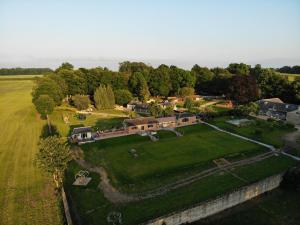 an aerial view of a house with a large yard at Normanton Park House - Luxury Rutland Water Home in Oakham