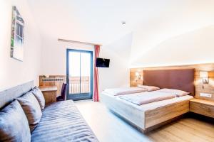 Postel nebo postele na pokoji v ubytování Hotel Sonnenheim