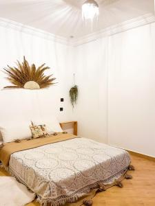 a bedroom with a bed in a white room at Desart Hostel in Agadir