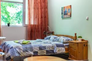 a bedroom with two beds and a window at Barcelona cute colorful apt w green backyard in Sofia