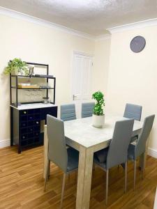 a dining room with a table and chairs at Charter House with good Wifi in Chatham