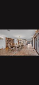 a large dining room with a table and chairs at Resort type home in Old Brookvile !!! in Glen Head