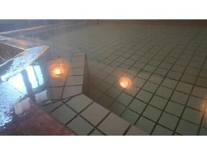 a pool with two lights on a tiled floor at Daikokuya Ryokan - Vacation STAY 53558v in Hakodate