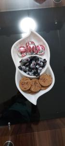 a plate with cookies and biscuits on a table at Stan na dan - Apartmani Q in Doboj