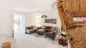 a living room with a couch and a table at Casa Bely - Arta in Artá