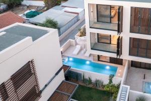 an aerial view of a house with a swimming pool at SithoniaRS Luxury Three Floors Villa With Private Pool & Garden in Nikiti