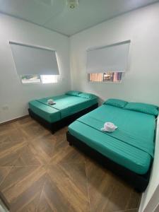 Een bed of bedden in een kamer bij CASA CAMPESTRE BELLO AMANECER
