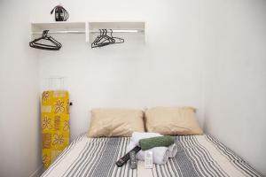 Un ou plusieurs lits dans un hébergement de l'établissement Kit 24h Wi-Fi Netflix Ar condicionado