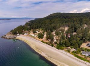 an aerial view of an island in the water at Emmonds Haven Retreat in Powell River