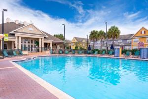 a large swimming pool at a resort at Enchanted Townhome near Disney Parks 3Br in Kissimmee