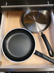 a frying pan and pans sitting on top of a stove at Stylish Boutique Studio in London