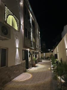 an empty street at night with a building at Villa Silia in Sharm El Sheikh