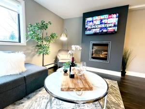 a living room with a couch and a table at The Cosmopolitan in Wortley Village in London