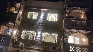 a building with a bunch of windows and lights at Villa Silia in Sharm El Sheikh