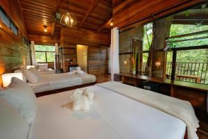 Postel nebo postele na pokoji v ubytování Maquenque Ecolodge