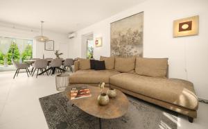 a living room with a couch and a table at Villa More Vodice in Vodice