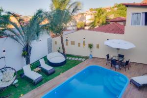 an image of a backyard with a swimming pool at Pousada Nanina de Geribá in Búzios