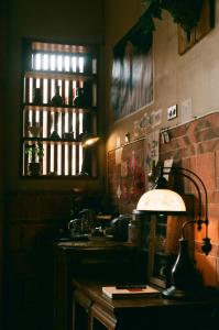 a kitchen with a table with a lamp on it at 序室 Narrative in Jinhu