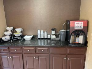 a counter with a coffee maker on top of it at Red Roof Inn Newport News - Yorktown in Yorktown