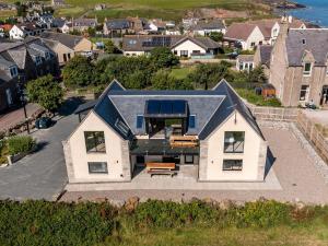 an aerial view of a house with a roof at Murlin in Collieston