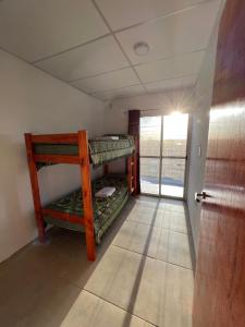 a room with two bunk beds and a door at Delsa in Concordia