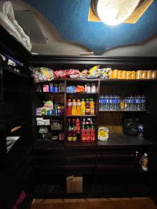a refrigerator filled with lots of different types of drinks at Hotel las Nieves LD in Bogotá